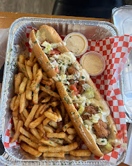 Loaded po' boys with fries and sauce