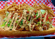Shrimp po' boy with drizzled sauce